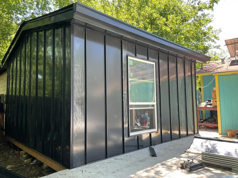 Black standing seam metal wall panels for Metal Roof Installation in Fishhook