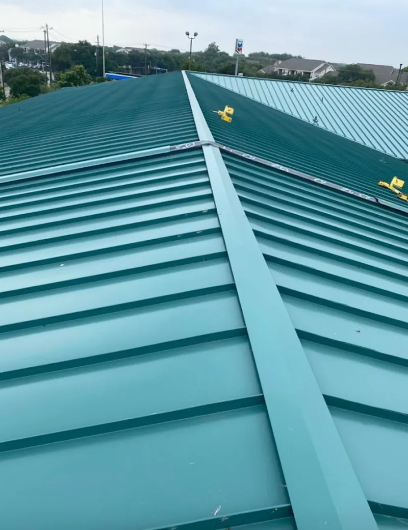 Green commercial metal roof ridge and valley for Metal Roof Repair in Fishhook
